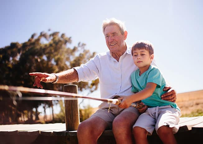 Grandfather fishing with Grandson